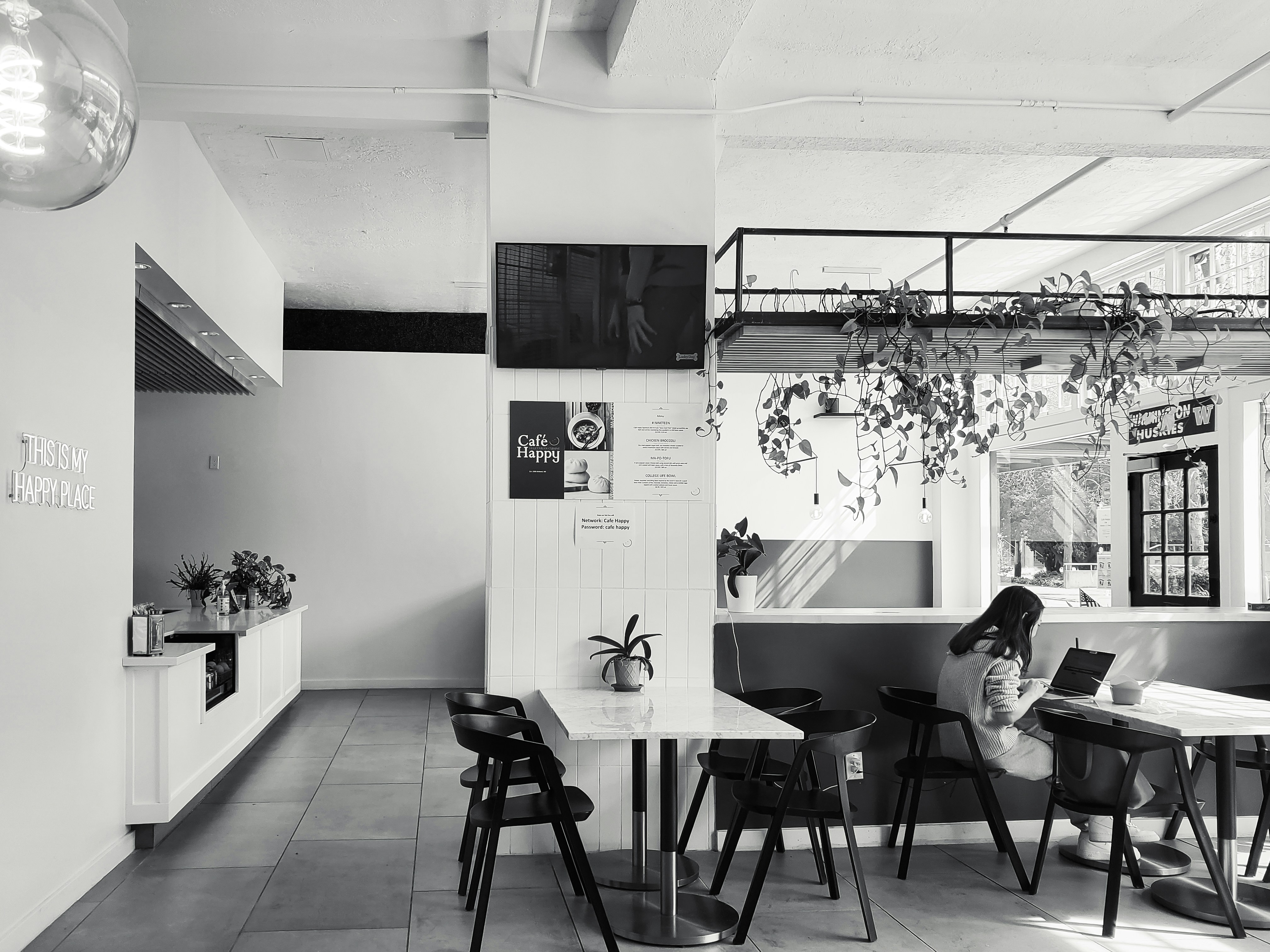 A sterile, minimalist specialty café — cold, empty, pretentious.